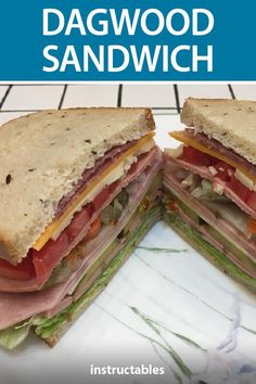 a sandwich cut in half sitting on top of a white plate with the words dagwood sandwich