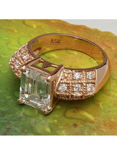 Rose gold CZ Emerald Cut Cubic Zirconia Diamond Ring With Rose Cut Emerald Shape, Luxury Rose Gold Emerald Cut Emerald Ring, Gia Certified Emerald Cut Rose Gold Jewelry, Rose Gold Emerald-cut Cubic Zirconia Jewelry, Emerald-cut Cubic Zirconia Ring For May Birthstone, Yellow Gold Setting