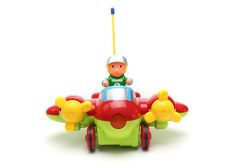 a small toy airplane with a man sitting on it's front wheel and holding a yellow stick