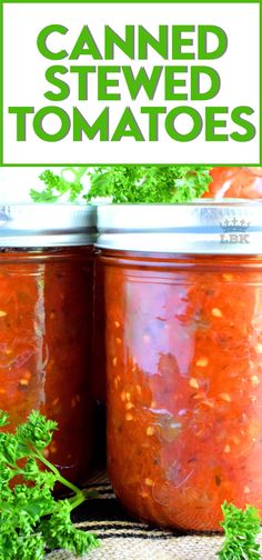 two jars filled with canned tomato sauce and garnished with parsley on the side