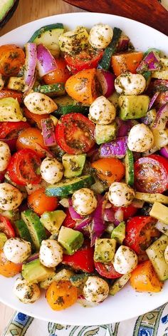 a white plate topped with lots of veggies