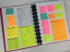 an open planner with notes on it and sticky notes attached to the pages in each section