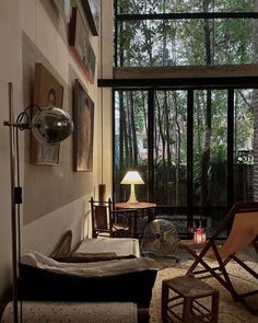 a living room filled with furniture and lots of windows