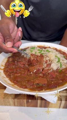 a person cutting up food on top of a white plate