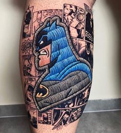 a man with a tattoo on his leg that has a batman image on it,