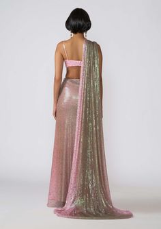 The kinfolk pink-brown ombre set features a printed applique embellished sequin tulle blouse, paired with a cinched waist draped sari. This ensemble blends vibrant hues and intricate detailing for a glamorous and elegant appearance. Ombre Saree, Tulle Blouse, Brown Ombre, Cinched Waist, Pink Brown, Unique Style, Sequin, Pink, Clothes