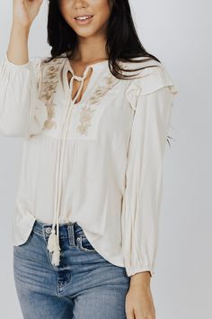 Description Floral Embroidered V neck Flutter Blouse Materials & Care 100% Viscose Gentle wash cold, Do not bleach, hang or line dry, cool iron if needed. Hand Measured Small: Length 20", Bust 19.5()", 20" Sleeve Medium: Length 21", Bust 20(40)", 21" Sleeve Large: Length 22", Bust 21(42)", 22" Sleeve Model wearing size Small ﻿﻿Model pictures have been edited, please refer to video for actual color reference. Spring Embroidered Long Sleeve Top With Ruffles, Flowy Embroidered Spring Tops, Spring Embroidered Flowy Top, Embroidered Flowy Spring Top, Cream Long Sleeve Blouse With Embroidered Sleeves, Cream V-neck Blouse With Floral Embroidery, Flowy Cotton Blouse With Floral Embroidery, Flowy Long Sleeve Blouse With Floral Embroidery, Spring Bohemian Tops With Tonal Embroidery