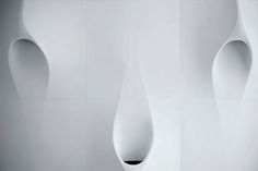 an abstract white wall with curved shapes