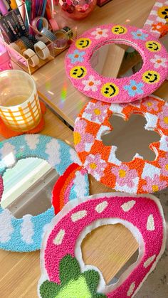 several decorated donuts are sitting on the table