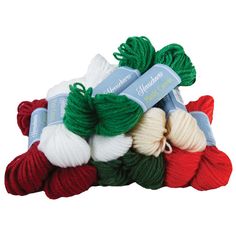 several skeins of yarn in different colors and sizes on a white background,