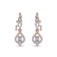 This Exclusive Diamond Drop Earring For Mom enthralls you with its magnificent beauty of the spectacular emerald cut diamond with your choice of color studded marvelously and highlighted by a series of tiny shimmering round shaped stones aligned beautifully in a gorgeous art deco design with a classic drop pattern offering you unmatched elegance and style.  Emerald cut stone of 1 ct. and round cut side stones of 1.21 ct. with Clarity VS2 and Color G in a prong, pave and bezel setting. Luxury Women's Jewelry With Diamond Markers, Buying An Engagement Ring, Emerald Cut Diamond, Diamond Earring, Platinum Metal, Rose Gold Metal, Diamond Drops, Diamond Drop Earrings, Art Deco Diamond