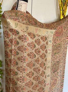 It is a most beautiful and elegant Kashmiri  kani hand woven pashmina shawl. It is a full size shawl. Length almost 3 yards. Width is 1.25 yards. Base color is beige with multi color flowers and a touch of silk thread . Very elegant and beautiful. Very lightweight. No return or exchange please. Multi Color Flowers, Kashmiri Shawls, Multi Colored Flowers, Wrap Scarf, Pashmina Shawl, Shawl Wrap, Silk Thread, Shawls And Wraps, Base Colour