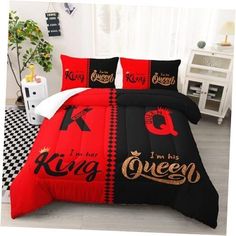 a bed with red and black comforters in a room