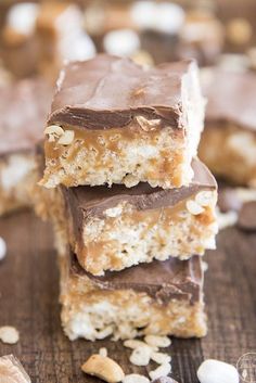 three pieces of chocolate peanut butter bars stacked on top of each other