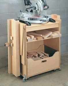 a circular sawhorse is sitting on top of a cabinet with drawers and tools in it