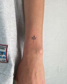 a person with a small tattoo on their arm