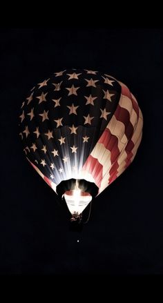 an american flag hot air balloon in the dark