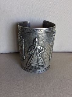 Vintage Peruvian Folkloric Sterling Long Cuff Bracelet - Artistic Etched Picture w Onlayed Design - Fine Execution - Makers Mark, Peru, .925 - No Scratches, Cracks or Dents - Like New Vintage Condition Etched Design is of a Tiled Walkway and Patterned Wall with Etched Onlays of Woman wearing Shawl, Window and Doorway on Street Scene.  Beautiful Scallop Design etched into edges of bracelet - Spanish Colonial influence Specifications:  Total Weight: circa 151.1 grams (c 5.32 oz) Size:  circa 3 1/2" L x Tapers from 2 3/8" to 2 5/8" W - Opening on back c 1 3/8" Flexible enough to open wider to accommodate a larger arm. Smooth Edges for a NO Scratch Wear. Installment Payments Available at Checkout!  Returns accepted if in Original Shipped Condition - Do NOT Polish It will be necessary to sign f Scallop Design, Patterned Wall, Etched Designs, Spanish Colonial, Smooth Edges, Tucson Az, Wall Patterns, Street Scenes, Makers Mark