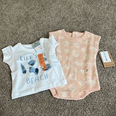 Baby Beach Themed Outfits 3-6mo Brand: Primark Cares And Easy-Peasy Size: 3-6 Months Style: Beach Themed T-Shirt (Life’s A Beach) And Onesie (Seashells) Condition: New/ Nwt Playful Pink Tops For Beach Season, Summer Short Sleeve Tops For Playtime, Pink Top For Playwear During Beach Season, Pink Tops For Playwear During Beach Season, Summer Tops With Short Sleeves For Playtime, Playful Tops For Beach Season Playtime, Cotton Tops For Beach Season Playwear, Casual Tops For Beach Season Playwear, Ruffle Outfit