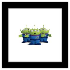 three green aliens in blue pants with one looking at the camera and two standing behind them