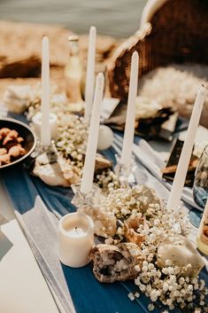 a table with candles and flowers on it