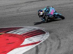 a person riding a motorcycle on a race track