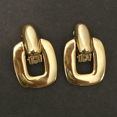 Vintage Givenchy large door knocker clip on earrings. An elegant pair of earrings with a gold plate finish. This beautiful set is marked Givenchy and in excellent vintage condition. Approx. size - 1 1/2" L x 1" W. Gold Earrings For Formal Occasions, Luxury Antique Clip-on Earrings For Gift, Luxury Vintage Clip-on Earrings For Party, Door Knocker Earrings 90s, Luxury Vintage Clip-on Hoop Earrings, Vintage Yellow Gold Metal Clip-on Earrings, Large Door, Vintage Givenchy, Door Knocker