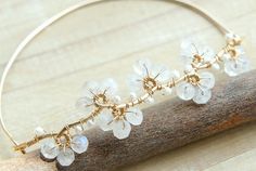 Moonstone Flower Bangle Wire Wrapped Bracelet White by Yukojewelry, $51.50 Delicate White Bangle Bracelet, Bohemian Wedding Bracelets With Flower Shape, White Spiritual Bangle Jewelry, Delicate Bangle Jewelry For Wedding, Wire Wrapped Bangle Jewelry For Wedding, Delicate White Bracelet For Anniversary, Handmade White Bangle For Wedding, Bohemian White Bangle Jewelry, Handmade White Wedding Bangle