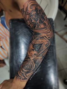 a man with a tattoo on his arm