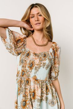 Adria Mini Dress | Camel + Blue | Baltic Born Bohemian Floral Dress With Smocked Bodice For Vacation, Bohemian Floral Dress With Smocked Bodice, Bohemian Mini Dress With Square Neck For Vacation, Bohemian Mini Dress With Smocked Bodice And V-neck, Blue And Bronze, Smocked Mini Dress, Baltic Born, Short Puff Sleeve, Chiffon Material