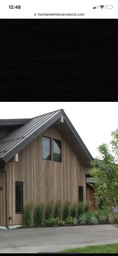 a house that is made out of wood and has metal roofing on the top