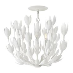 a chandelier with white flowers hanging from it's center point and two lights on each side