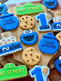 cookie decorated cookies are arranged on a wooden board with the numbers 1, 2, and 3