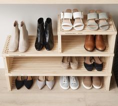 there are many pairs of shoes on the shelf