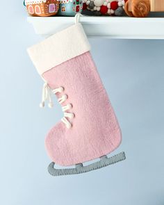 a pink stocking hanging from a shelf