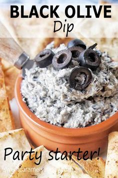 black olive dip party starter with crackers and pita chips