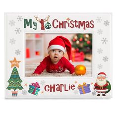 a christmas photo frame with santa claus and presents on the floor in front of it