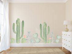 a room with a large cactus mural on the wall