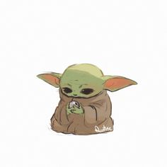 the child yoda is sitting down and holding something in his hands with one hand