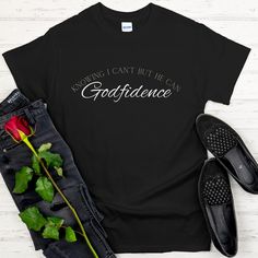 "Introducing our \"Godfidence\" T-Shirt, a powerful and profound expression of unshakable faith and confidence in God. This tee serves as a constant reminder that with God by our side, we can overcome any challenge, knowing that where our abilities end and where His power begins. Key Features: 1.Empowering Message: The impactful phrase \"Godfidence: Knowing I can't be He can\" takes center stage, encapsulating the essence of unwavering belief in God's strength and guidance. It's a testament to the transformative power of faith. 2.Premium Quality: We believe in providing you with the best. This t-shirt is crafted from premium materials, offering superior comfort and durability for all-day wear. 3.Thoughtful Design: The design of this tee is carefully curated to ensure the message is clear a Confident Tshirt, Gods Favorite Shirt, Unshakable Faith, Confidence In God, God Fidence Shirt, Faith Based Shirts, Faith Based Shirt, Jesus T Shirts Graphic Tees, Gods Strength