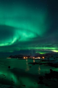 the aurora lights shine brightly in the night sky