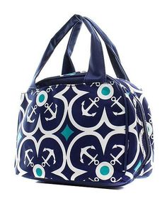 a blue and white handbag with an anchor design on the front, two handles