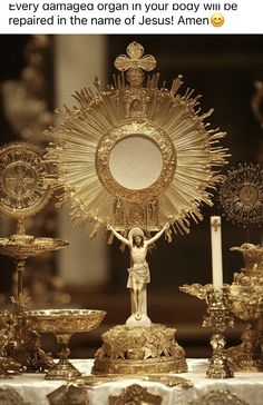 a table topped with lots of gold items and a cross on top of each other