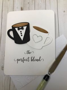 a card with a coffee cup and a bow tie on it next to a knife