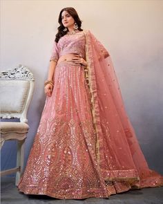 Color-Peach Fabric- Butterfly Net & Georgette Work- Sequins Peach color lehenga in butterfly net fabric enhanced with sequins work embroidery all over paired with matching thread and sequins work embroidered slub georgette blouse and butterfly net sequins work matching dupatta. Dupatta is further enhanced with laces on borderline. Peach Color Lehenga, Peach Lehenga, Heavy Lehenga, Engagement Lehenga, Bridal Lehenga Online, Mirror Work Lehenga, Butterfly Net, Reception Lehenga, Lehenga Choli Wedding