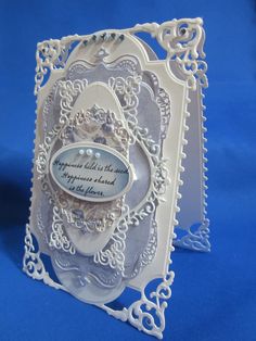 a white card with an ornate design on it