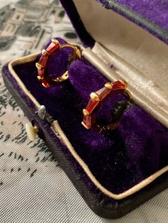 Magnificent vintage earrings in gold-plated and baguette-cut red stones. . elegant shape, superb design, set with garnet red color stone, in very good condition. box not included. Vintage Baguette Cut Jewelry For Formal Occasions, Vintage Gold-plated Earrings For Evening, Vintage Gold Plated Earrings For Evening, Elegant Red Hoop Earrings For Formal Occasions, Classic Evening Ruby Jewelry, Elegant Red Hoop Jewelry, Retro Yellow Gold Jewelry For Evening, Red Hoop Jewelry For Formal Occasions, Vintage Gold-plated Hallmarked Earrings