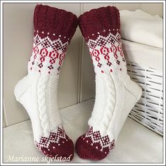 there is a pair of red and white knitted socks