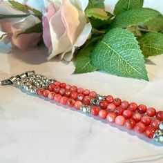 Chic beaded Apple iWatch band. Features Coral pink and silver toned beads with crystal accents. Sizing Options: When measuring your wrist please provide your fitted wrist measurement (exact measurement of your wrist- this is very important!). I will adjust the size to allow for a little room for movement. If you have questions on how to measure, please contact me 😊Compatible with all Apple Watch seriesPlease note – due to sizing your bracelet may vary slightly from what is pictured. I may need Silver Beaded Bracelets With Round Beads, Christmas Eve Candlelight Service, Silver Apple Watch Band, Silver Apple Watch, Candlelight Service, Silver Apple, Beaded Watches, Custom Teacher Gifts, Iwatch Apple