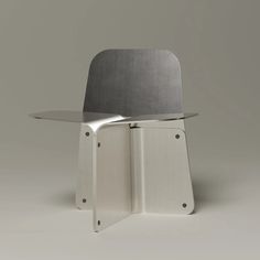 a metal chair sitting on top of a table